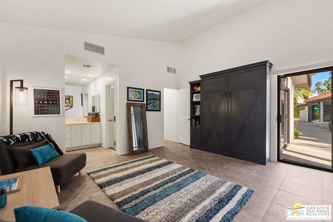 40563 Desert Creek Lane Rancho Mirage, CA 92270 - Photo 61 of 75 a living room with furniture and a rug