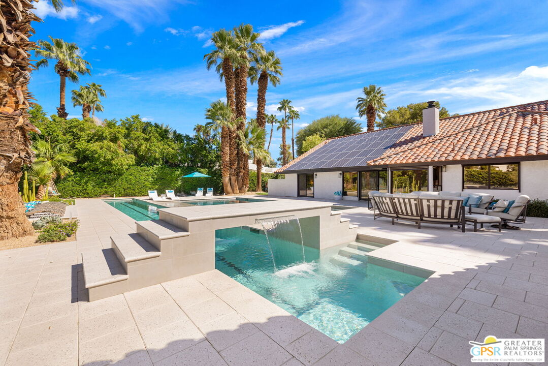 40563 Desert Creek Lane Rancho Mirage, CA 92270 - Photo 67 of 75 a view of a house with a swimming pool