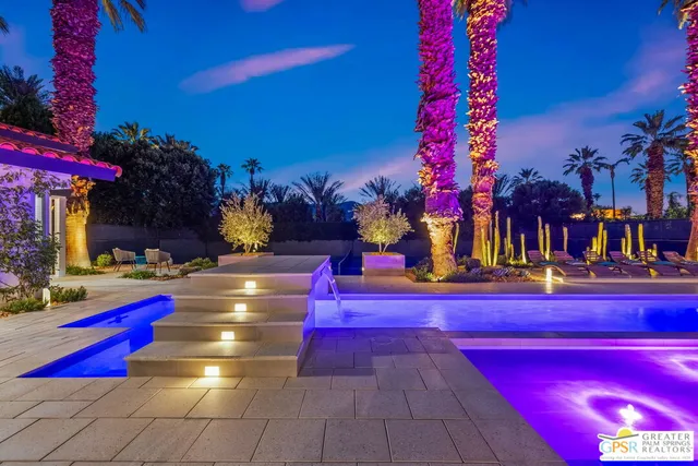 a view of swimming pool with outdoor seating