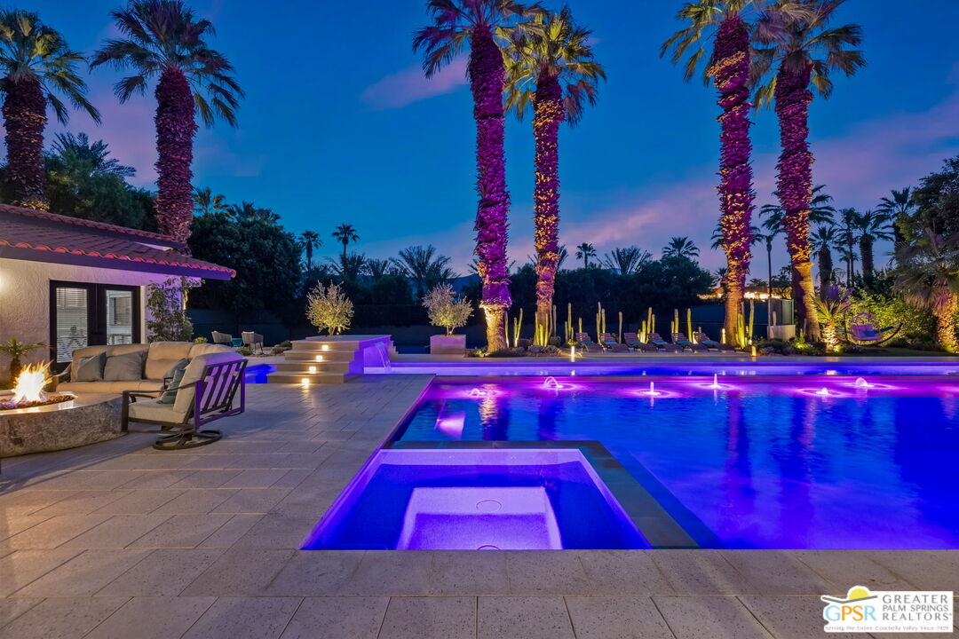 40563 Desert Creek Lane Rancho Mirage, CA 92270 - Photo 8 of 75 a view of swimming pool with a table and chairs and a fire pit