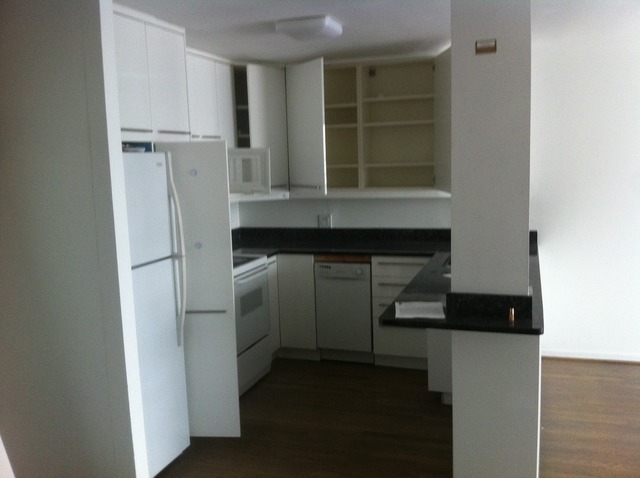 5415 North Sheridan Road, Unit 1002 Chicago, IL 60640 - Photo 7 of 11 a kitchen with a refrigerator and a sink