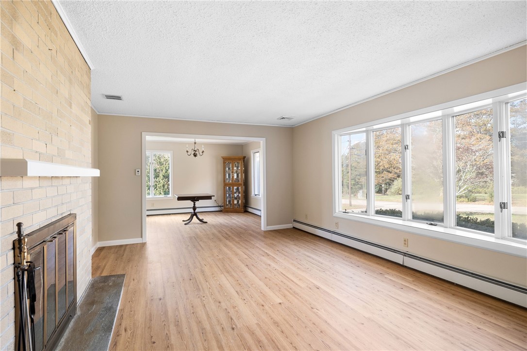 23 Hillview Drive Westerly, RI 02891 - Photo 16 of 32 Living room opens to dining room for easy entertaining