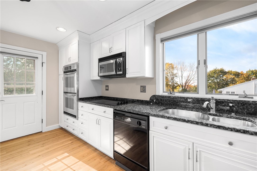 23 Hillview Drive Westerly, RI 02891 - Photo 8 of 32 Door to patio from kitchen makes grilling a breeze