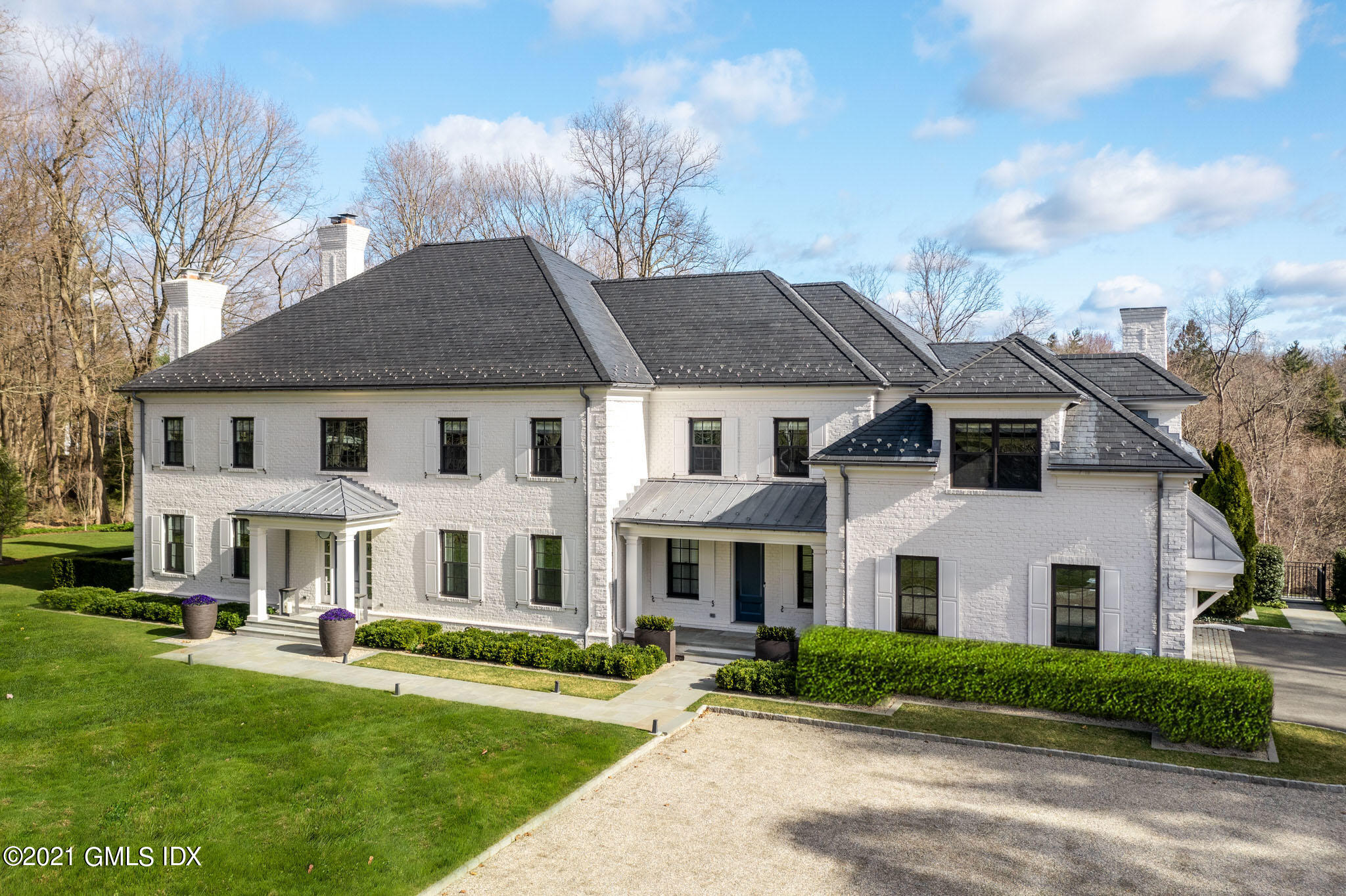 a view of house that has a yard