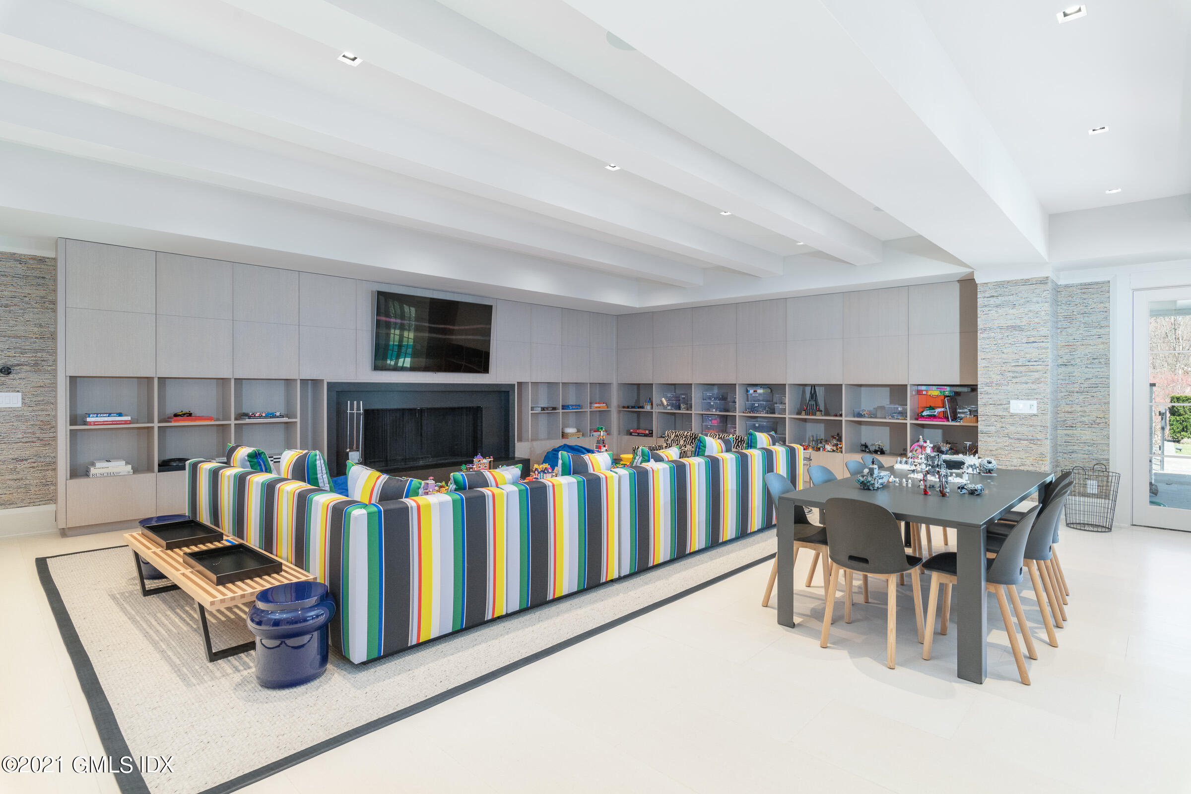 425 North Maple Avenue Greenwich, CT 06830 - Photo 20 of 30 a living room with furniture fireplace and a flat screen tv