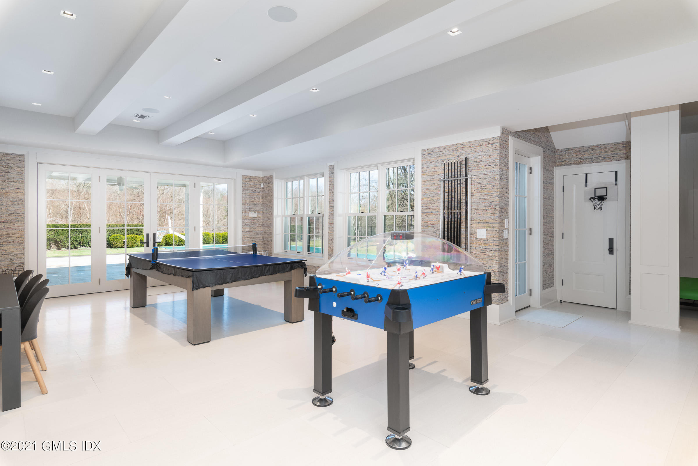 425 North Maple Avenue Greenwich, CT 06830 - Photo 21 of 30 a living room with furniture a table and a large window