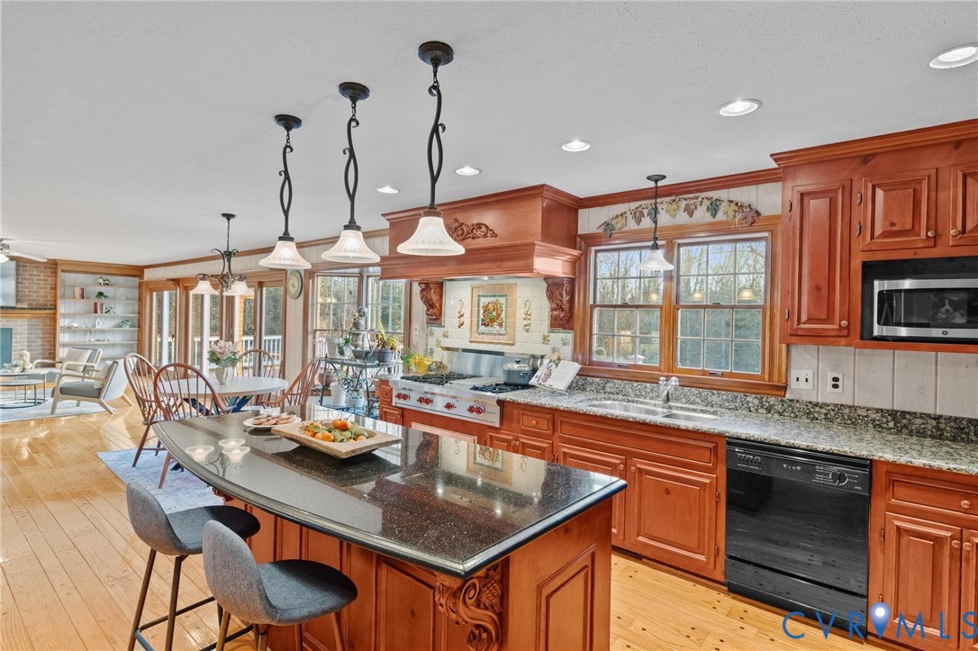 1517 Old Church Road Mechanicsville, VA 23111 - Photo 16 of 50 Kitchen with dark stone countertops, a center isla