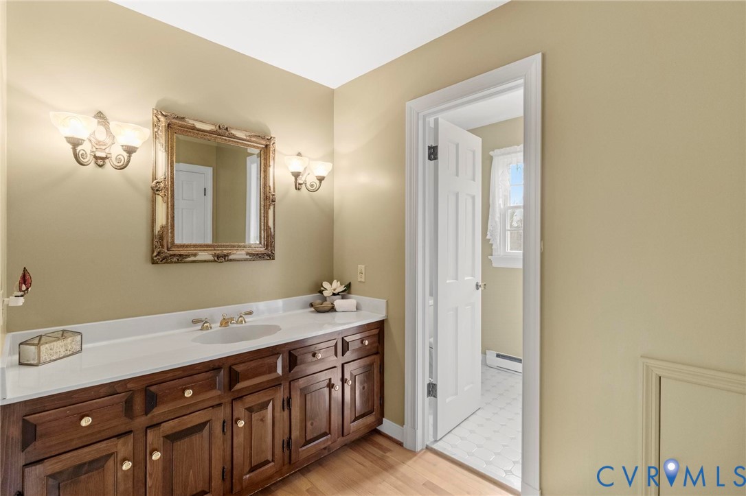 1517 Old Church Road Mechanicsville, VA 23111 - Photo 25 of 50 Bathroom featuring vanity, a baseboard radiator, a