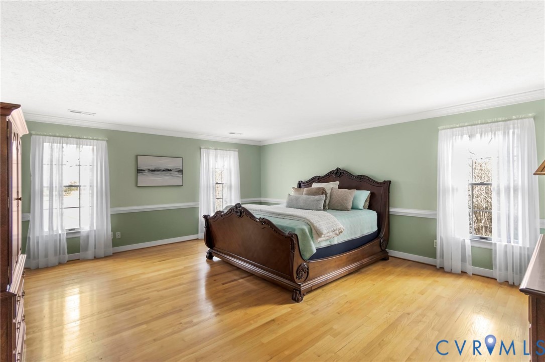 1517 Old Church Road Mechanicsville, VA 23111 - Photo 28 of 50 Bedroom with light wood-style flooring, crown mold
