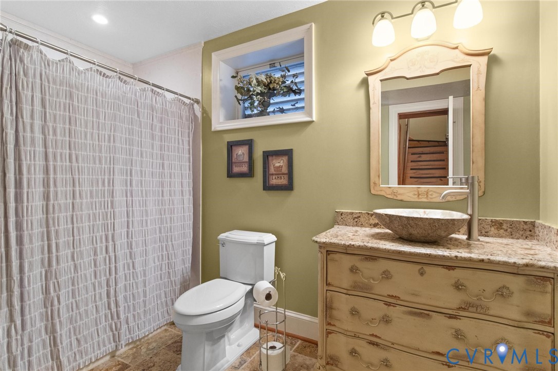 1517 Old Church Road Mechanicsville, VA 23111 - Photo 38 of 50 Bathroom featuring vanity and curtained shower