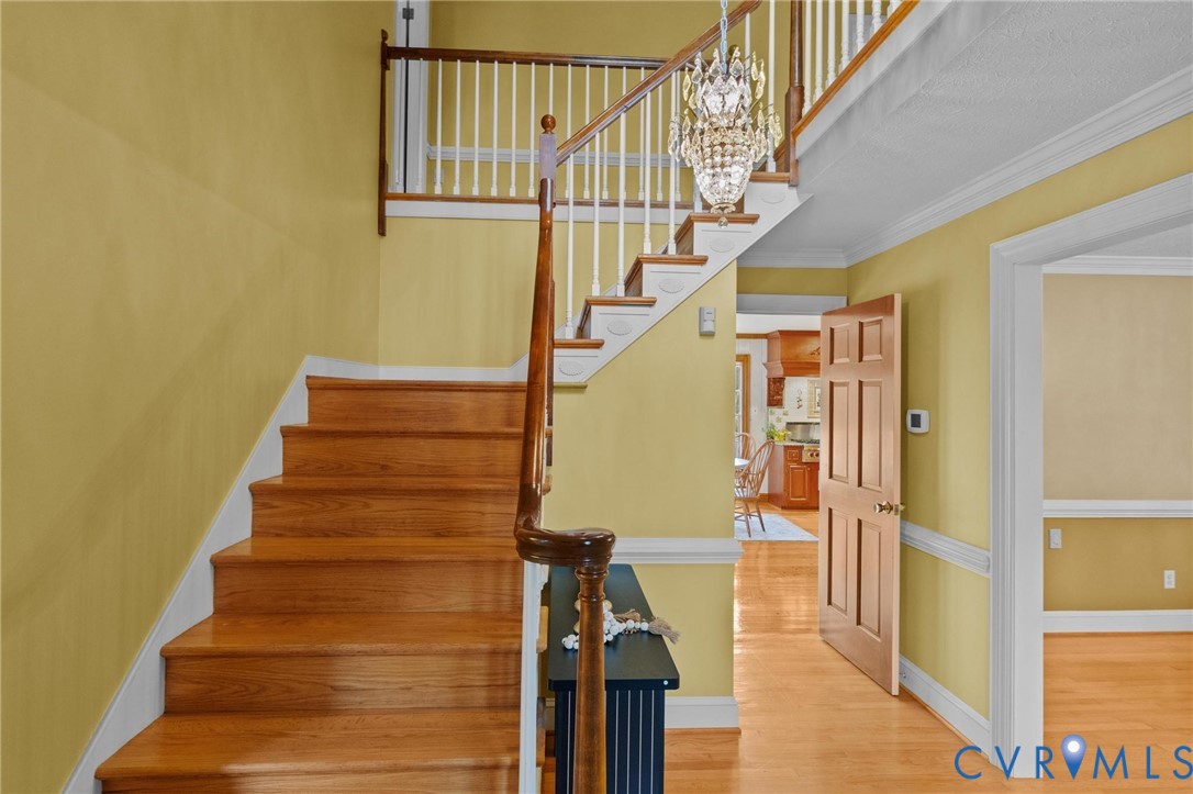 1517 Old Church Road Mechanicsville, VA 23111 - Photo 4 of 50 Staircase with wood finished floors and crown mold