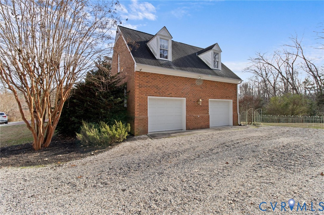 1517 Old Church Road Mechanicsville, VA 23111 - Photo 48 of 50 View of side of home featuring a garage, brick sid