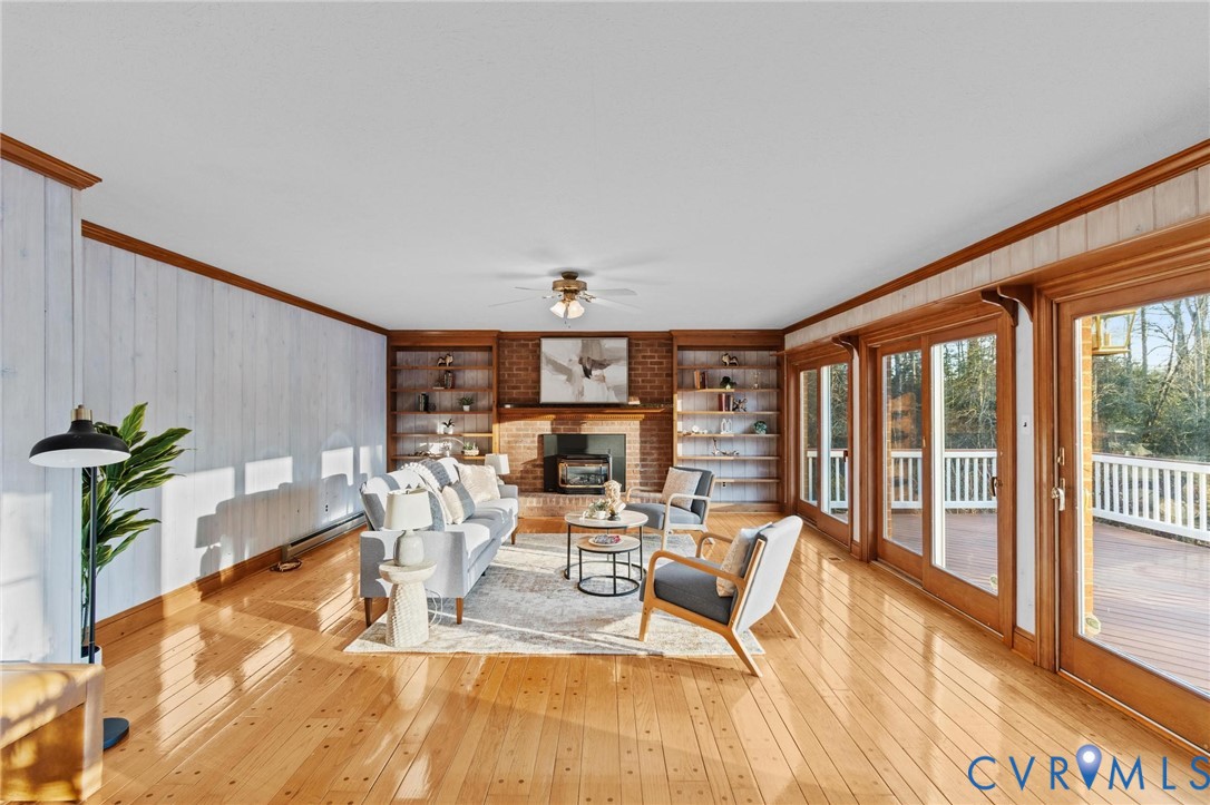 1517 Old Church Road Mechanicsville, VA 23111 - Photo 9 of 50 Living area featuring wooden walls, crown molding,