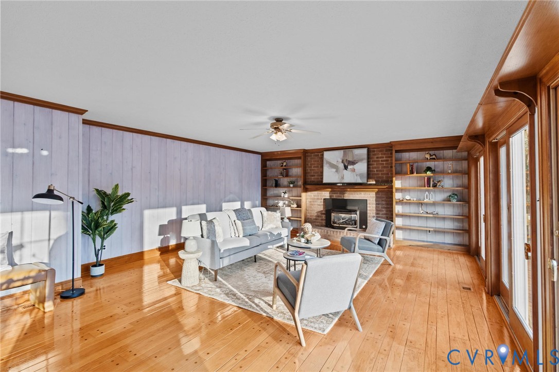 1517 Old Church Road Mechanicsville, VA 23111 - Photo 10 of 50 Living room featuring crown molding, wood walls, a