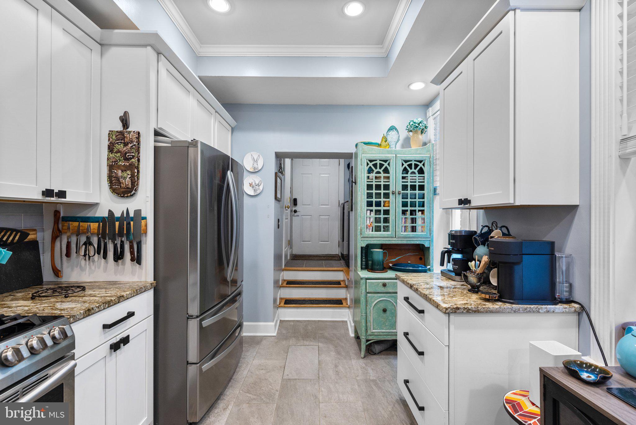 3228 Fait Avenue Baltimore, MD 21224 - Photo 15 of 44 a kitchen with a refrigerator and a stove top oven