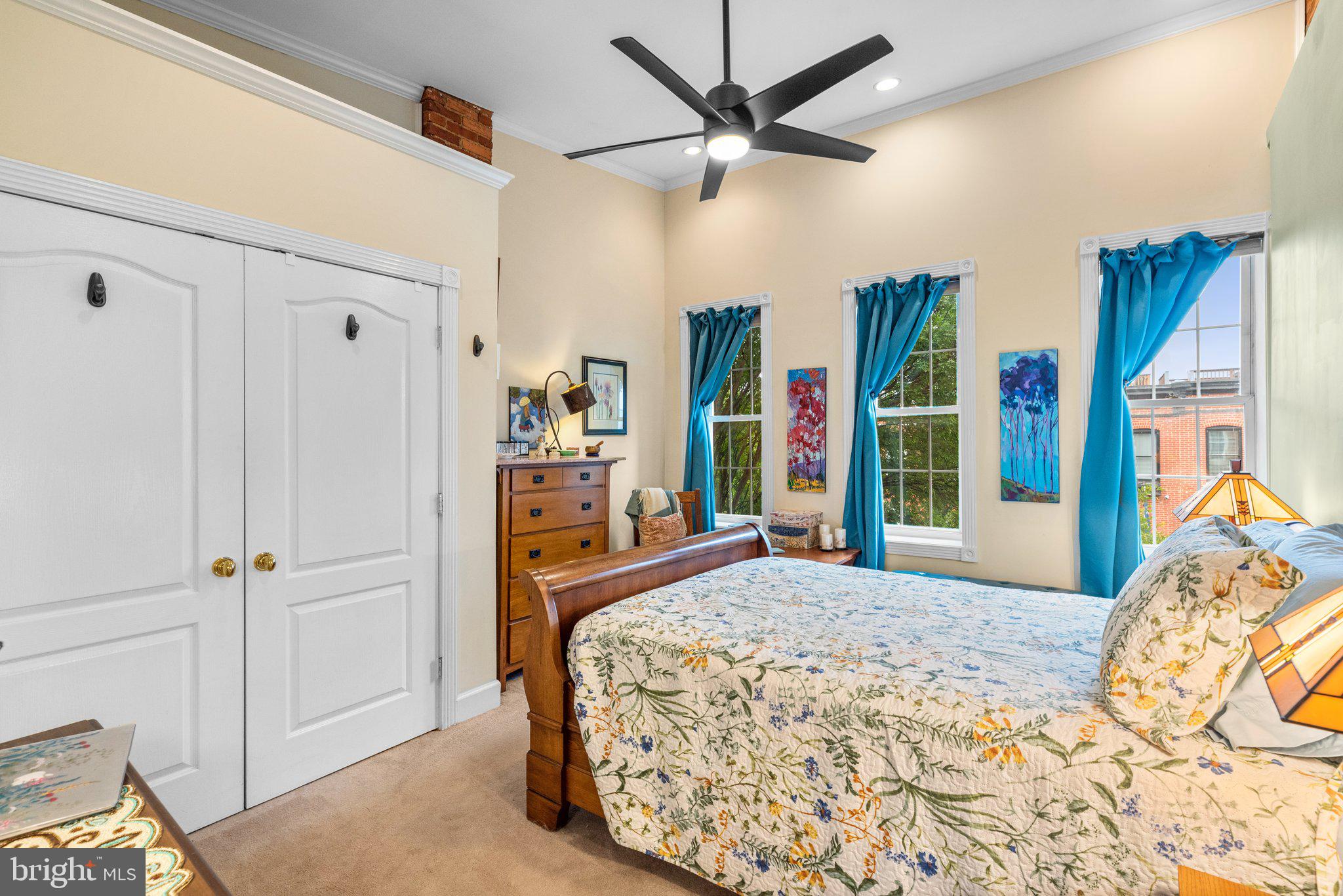 3228 Fait Avenue Baltimore, MD 21224 - Photo 21 of 44 a bedroom with a large bed and a chandelier