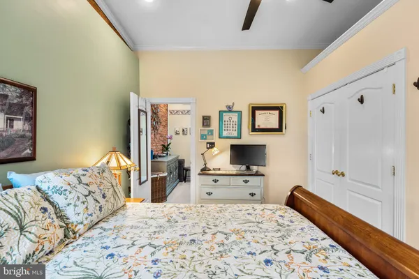a bedroom with a bed and a dresser in it