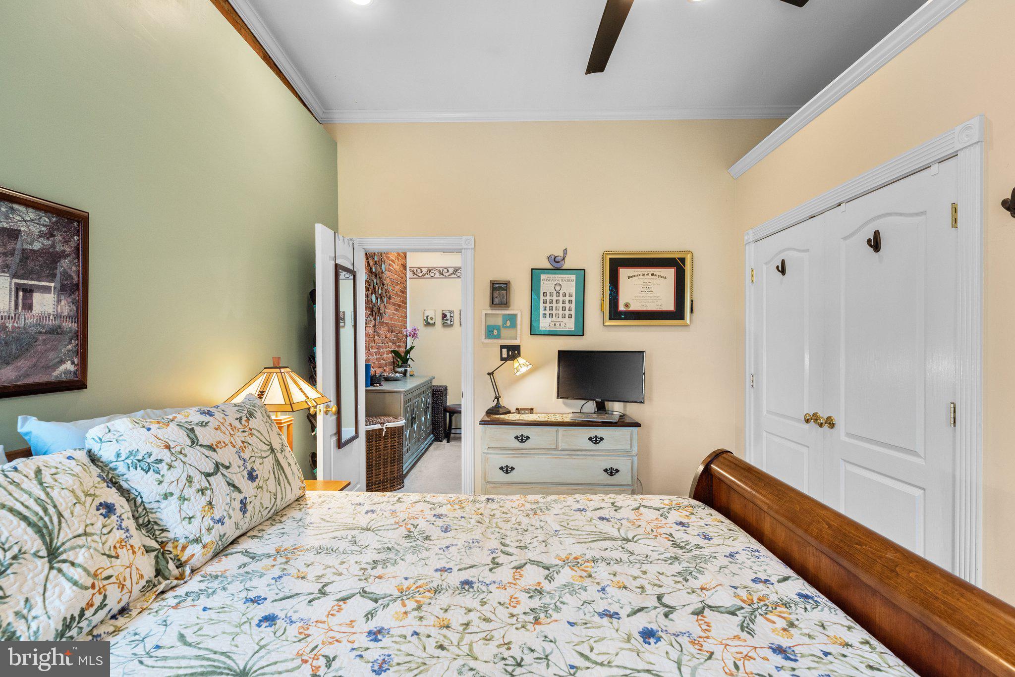 3228 Fait Avenue Baltimore, MD 21224 - Photo 22 of 44 a bedroom with a bed and a dresser in it