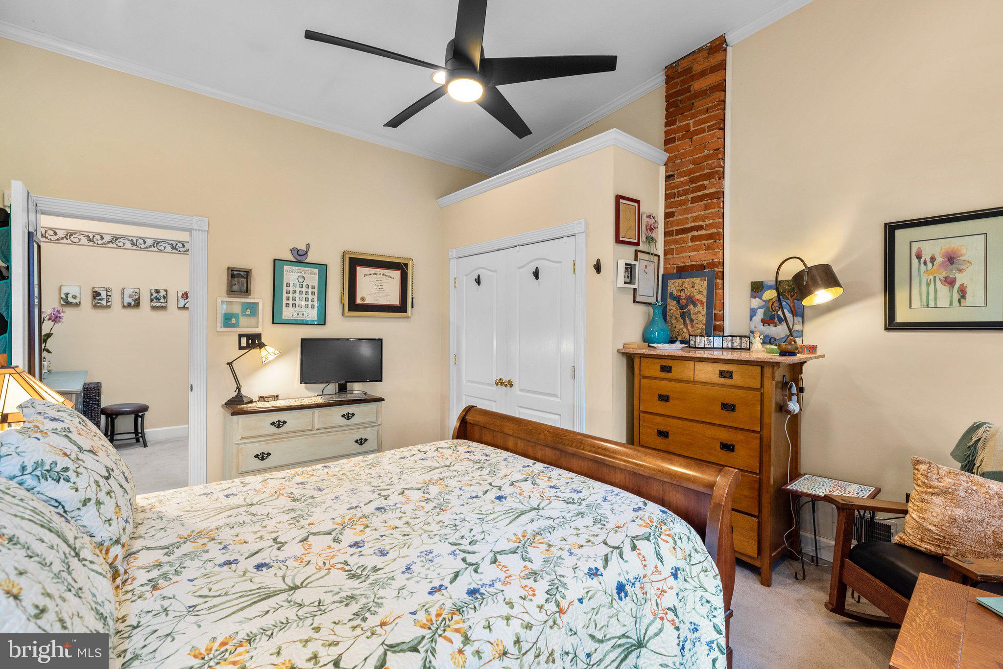 3228 Fait Avenue Baltimore, MD 21224 - Photo 23 of 44 a bedroom with a bed and furniture flat screen tv