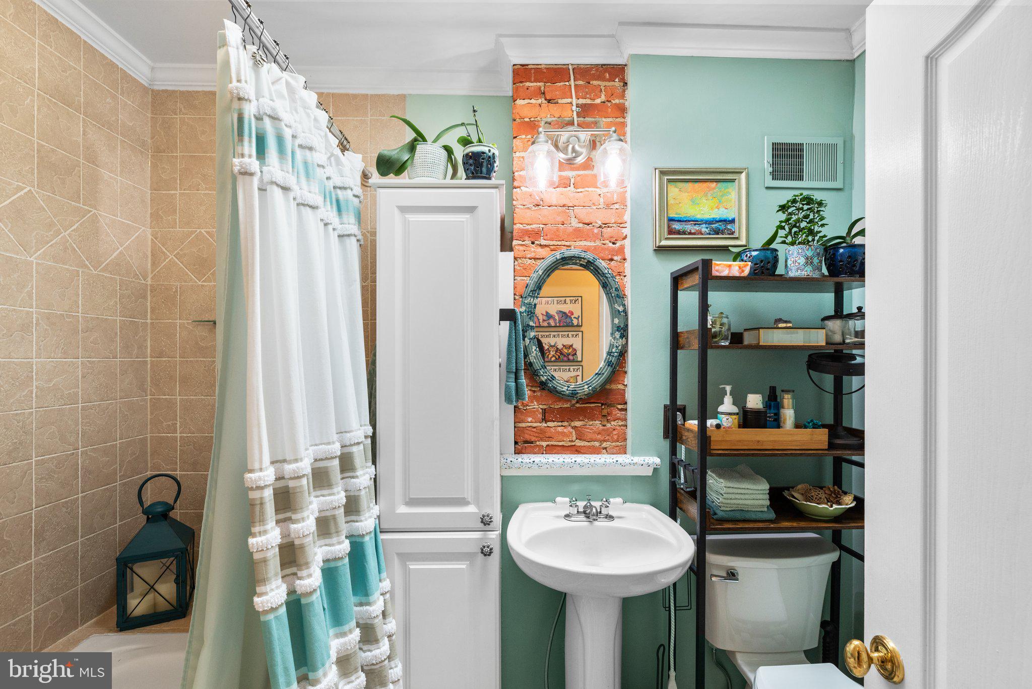 3228 Fait Avenue Baltimore, MD 21224 - Photo 24 of 44 a bathroom with a toilet sink and mirror