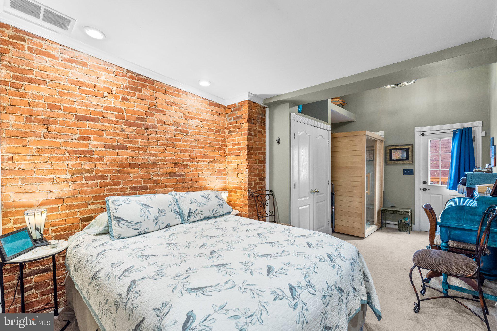 3228 Fait Avenue Baltimore, MD 21224 - Photo 26 of 44 a bedroom with a bed and chair