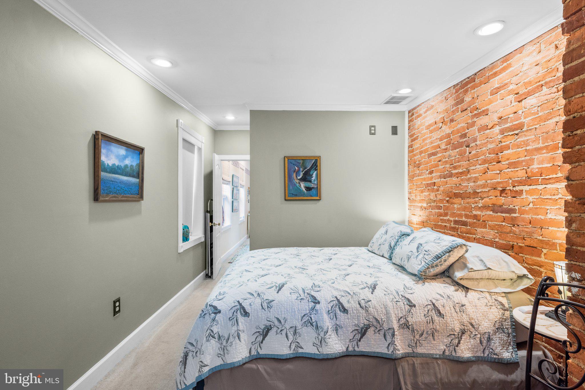 3228 Fait Avenue Baltimore, MD 21224 - Photo 27 of 44 a bedroom with a bed and a painting