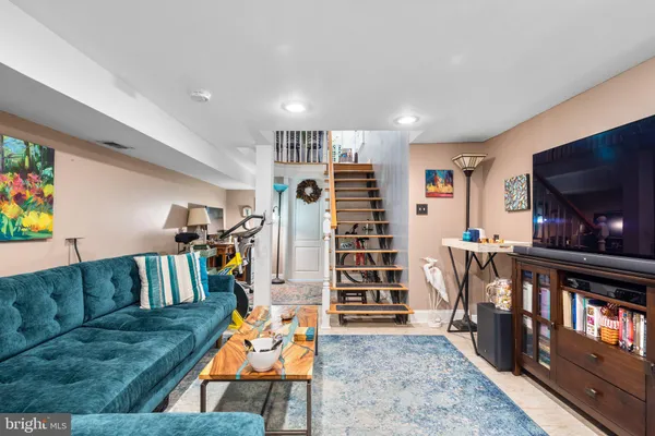 a living room with lots of furniture and a flat screen tv