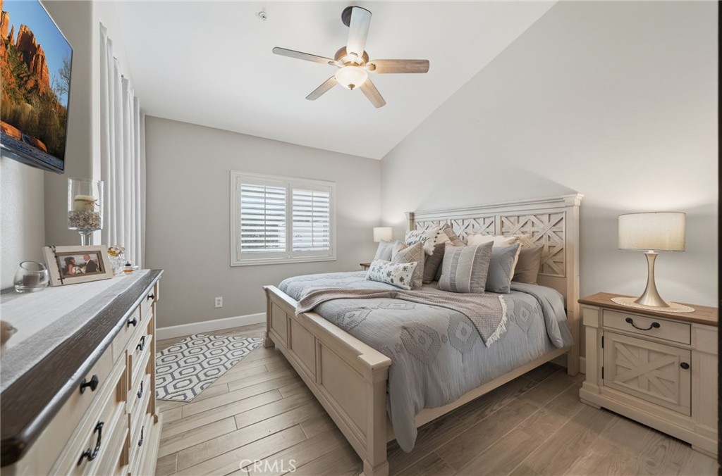 33433 Emerson Way, Unit A Temecula, CA 92592 - Photo 11 of 31 a bedroom with a bed and a chandelier