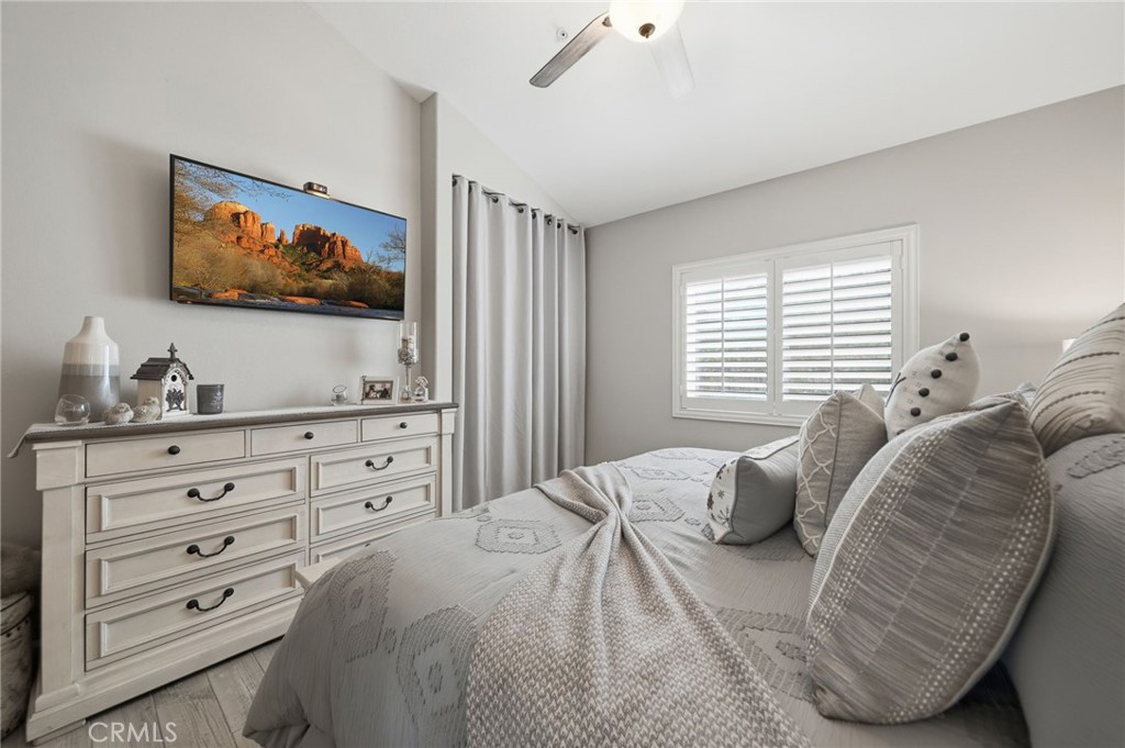 33433 Emerson Way, Unit A Temecula, CA 92592 - Photo 12 of 31 a bedroom with furniture and a flat screen tv