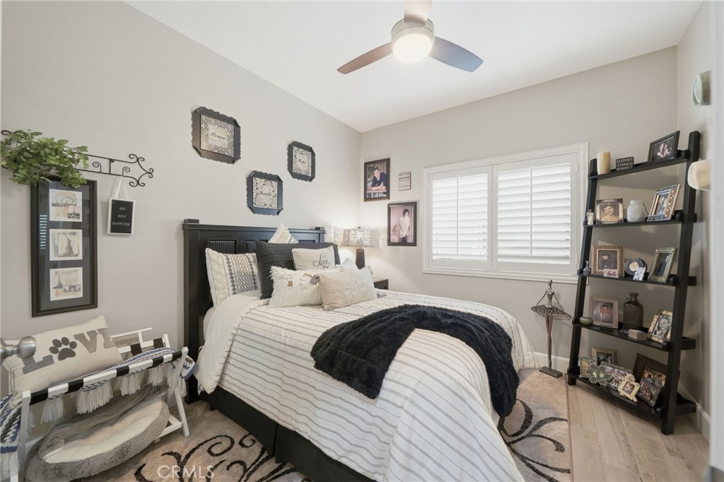 33433 Emerson Way, Unit A Temecula, CA 92592 - Photo 15 of 31 a bedroom with a bed and a large mirror on the dresser