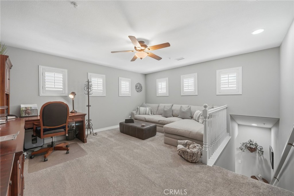 33433 Emerson Way, Unit A Temecula, CA 92592 - Photo 19 of 31 a living room with furniture and a window