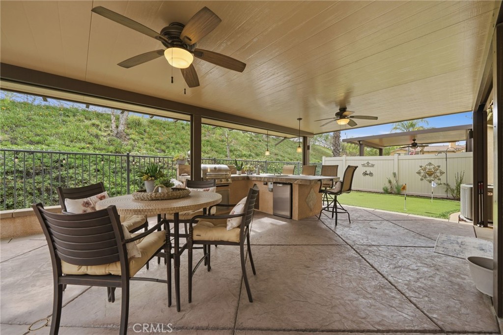 33433 Emerson Way, Unit A Temecula, CA 92592 - Photo 24 of 31 a dining room with furniture and a large window