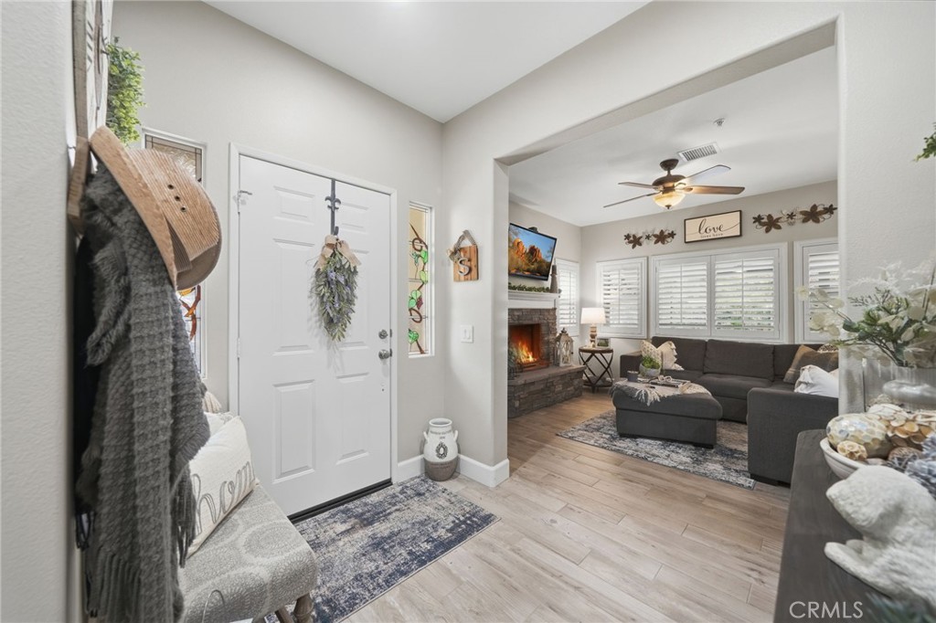 33433 Emerson Way, Unit A Temecula, CA 92592 - Photo 3 of 31 a living room with furniture and a rug