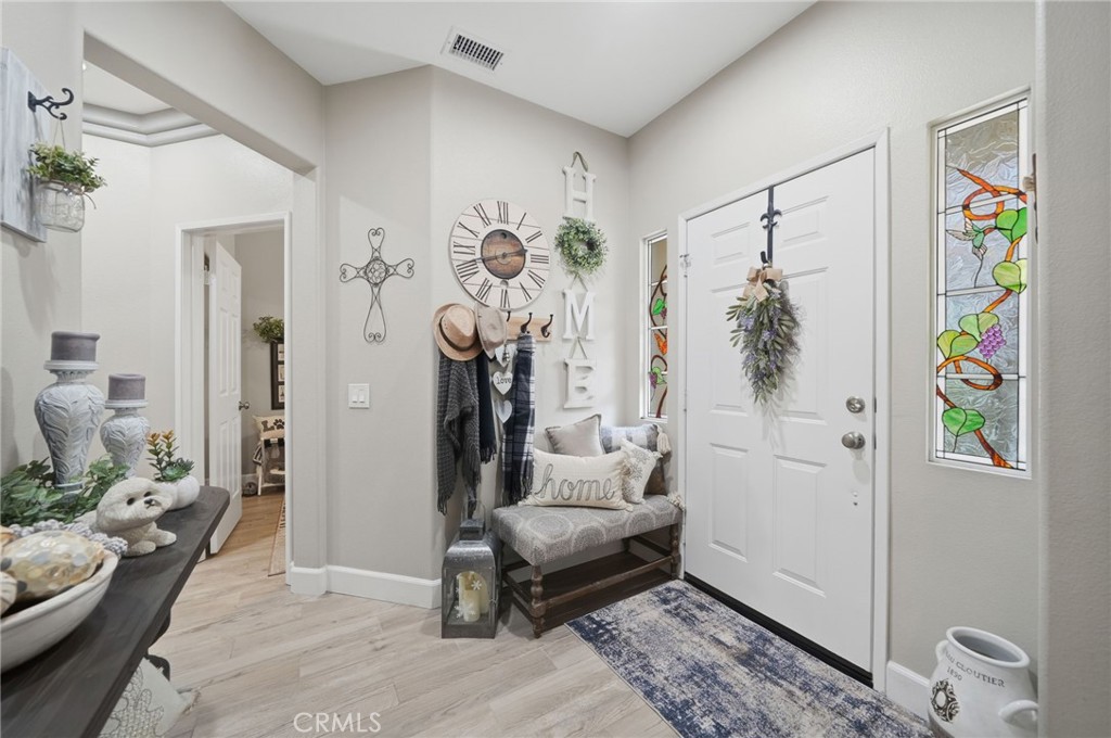 33433 Emerson Way, Unit A Temecula, CA 92592 - Photo 4 of 31 a living room with furniture and a rug