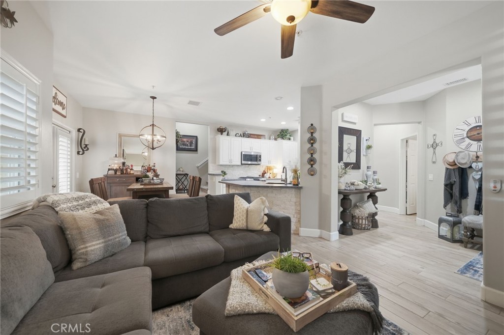 33433 Emerson Way, Unit A Temecula, CA 92592 - Photo 5 of 31 a living room with furniture kitchen view and a window