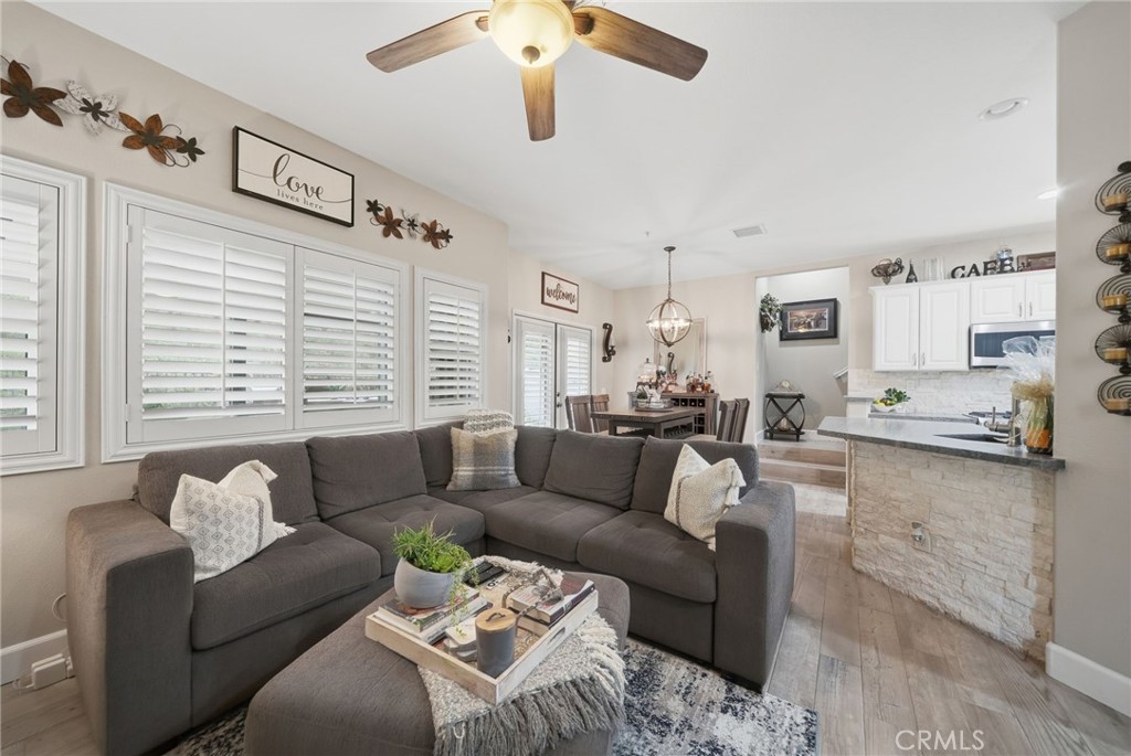 33433 Emerson Way, Unit A Temecula, CA 92592 - Photo 6 of 31 a living room with furniture and a large window