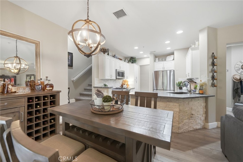 33433 Emerson Way, Unit A Temecula, CA 92592 - Photo 9 of 31 a large kitchen with a table and chairs