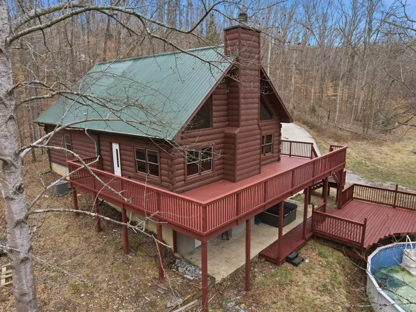 an aerial view of a house with a roof deck