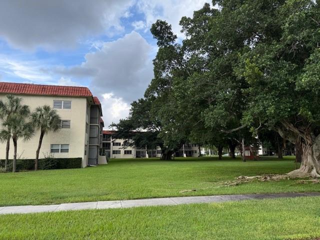 8990 South Hollybrook Boulevard, Unit 302 Pembroke Pines, FL 33025 - Photo 2 of 13 a view of a golf course with a play ground