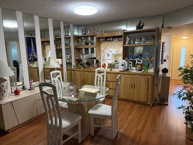 8990 South Hollybrook Boulevard, Unit 302 Pembroke Pines, FL 33025 - Photo 5 of 13 a view of a dining room with furniture and wooden floor