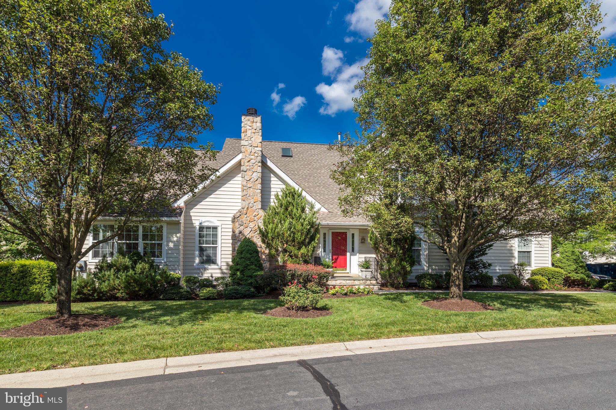 20135 Valhalla Square Ashburn, VA 20147 - Photo 2 of 41 a front view of a house with a yard and garage