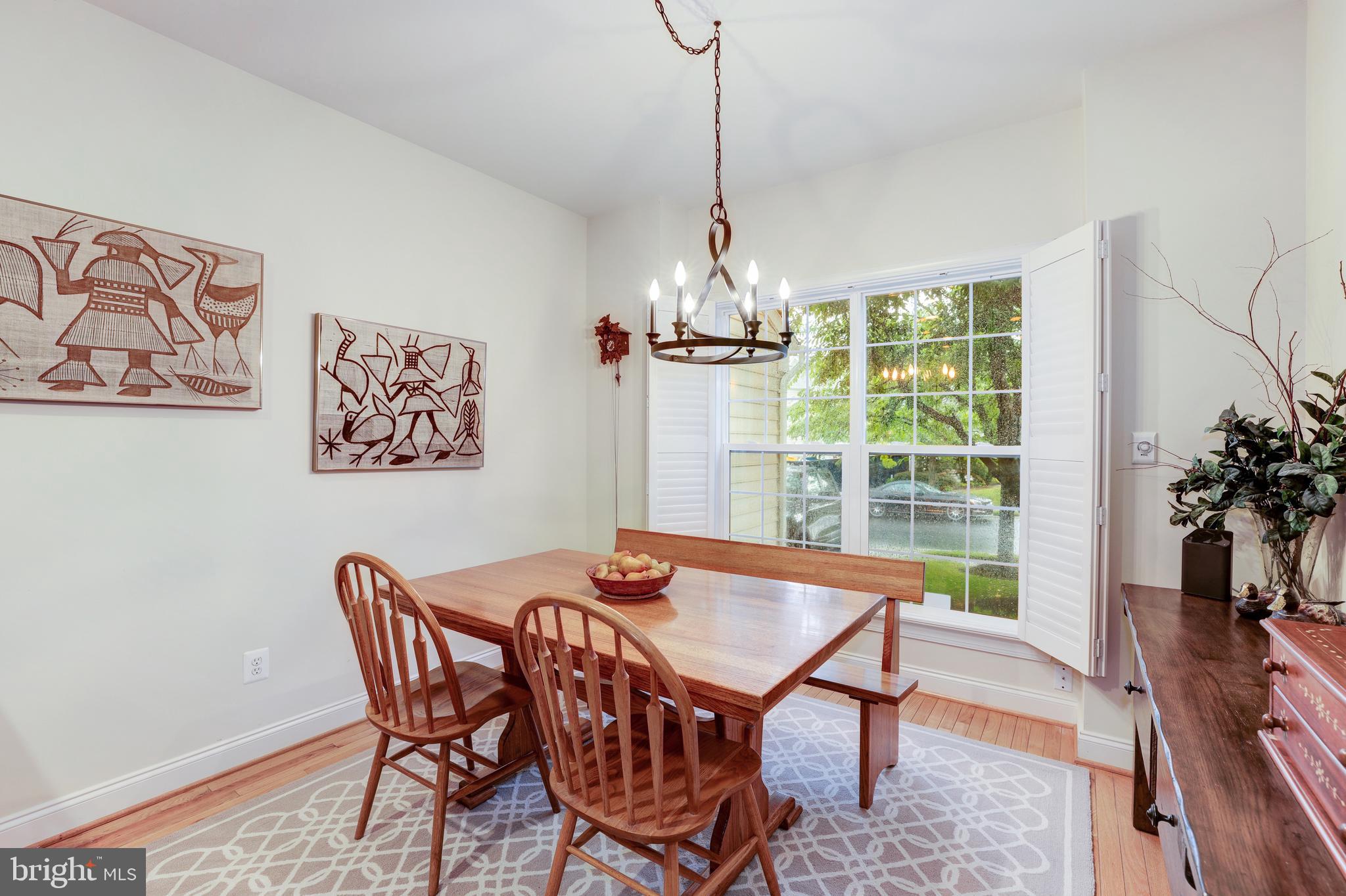 20135 Valhalla Square Ashburn, VA 20147 - Photo 16 of 41 a dining room with furniture a chandelier and wooden floor