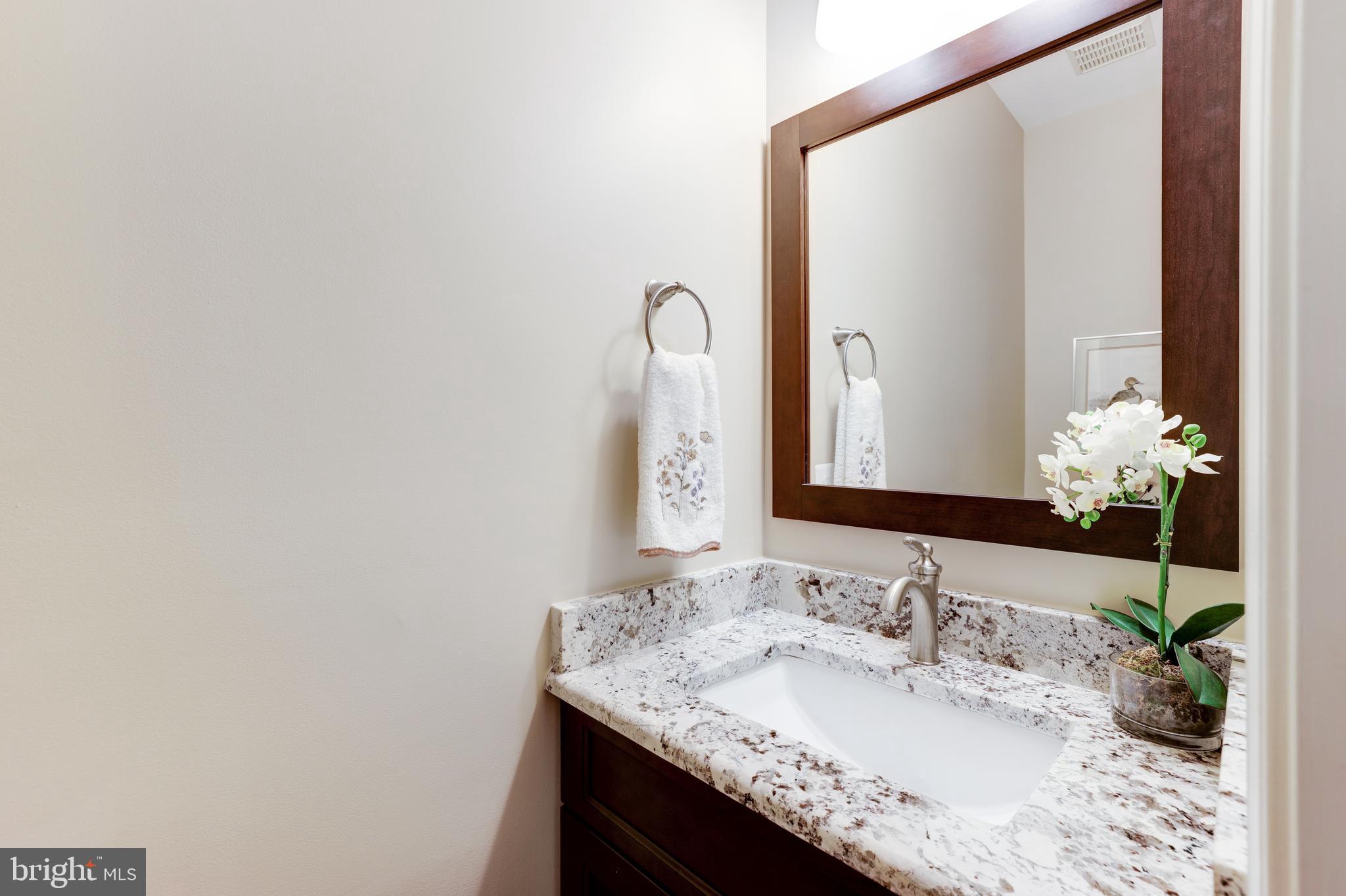 20135 Valhalla Square Ashburn, VA 20147 - Photo 17 of 41 a bathroom with a granite countertop sink and a mirror