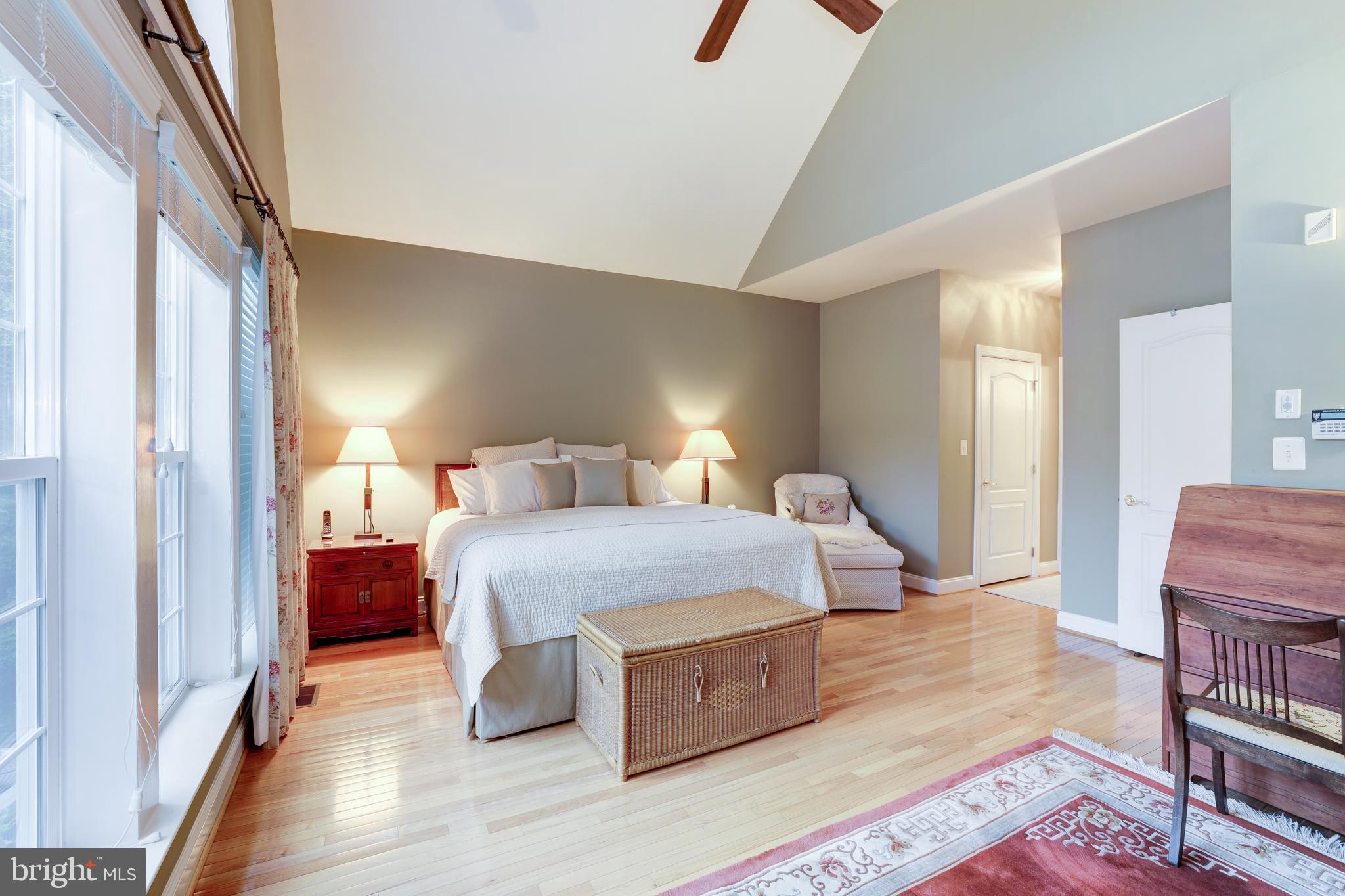 20135 Valhalla Square Ashburn, VA 20147 - Photo 18 of 41 a bedroom with a bed and wooden floor