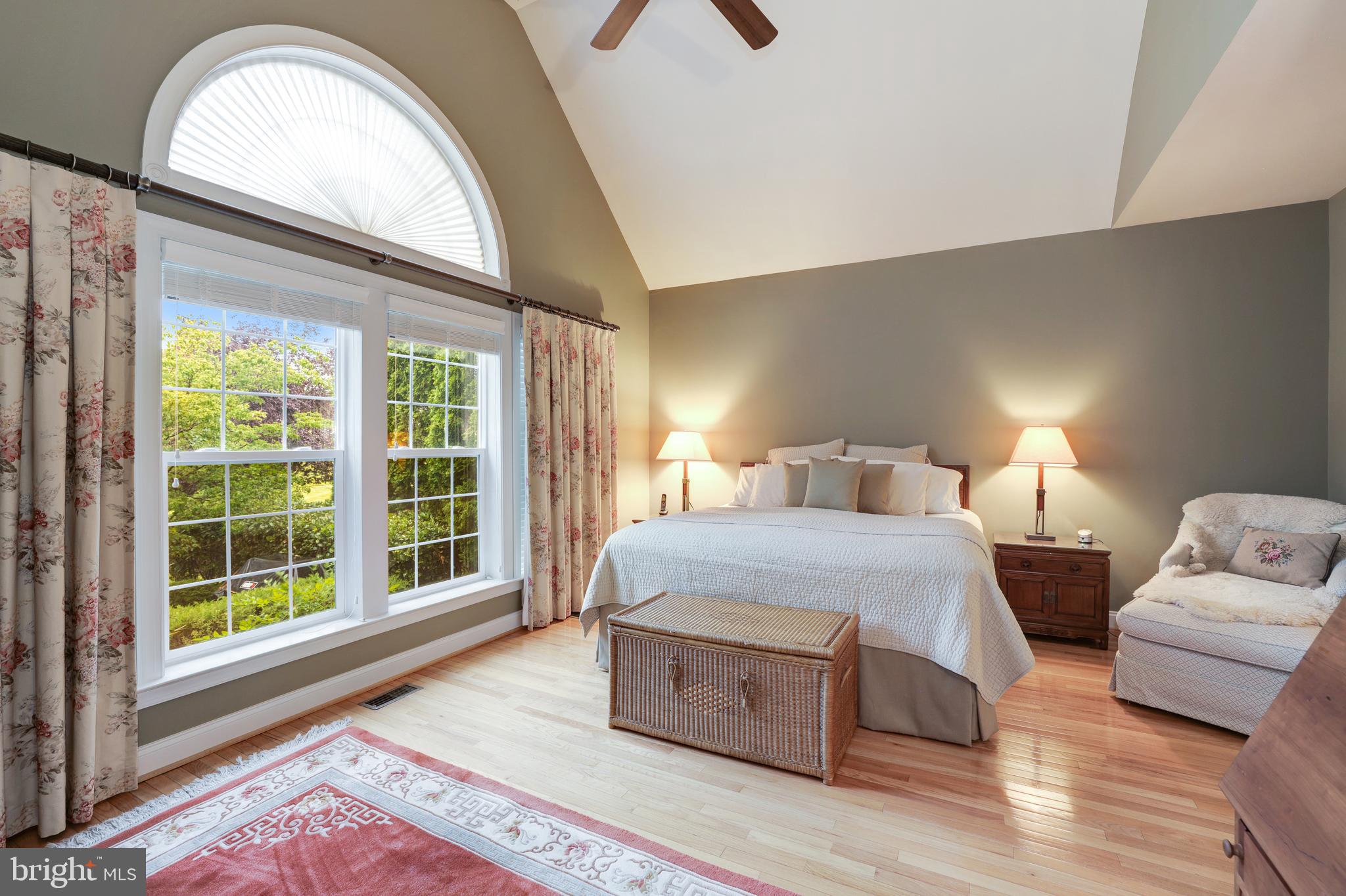 20135 Valhalla Square Ashburn, VA 20147 - Photo 19 of 41 a bedroom with a large bed and a large window