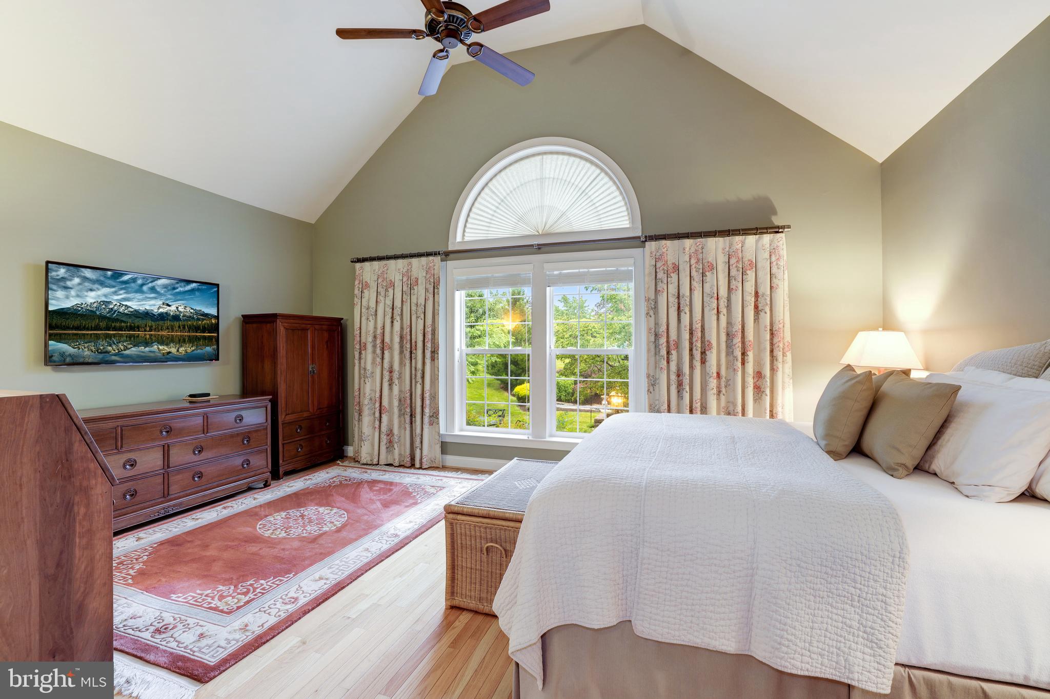 20135 Valhalla Square Ashburn, VA 20147 - Photo 20 of 41 a bedroom with a bed and a flat screen television
