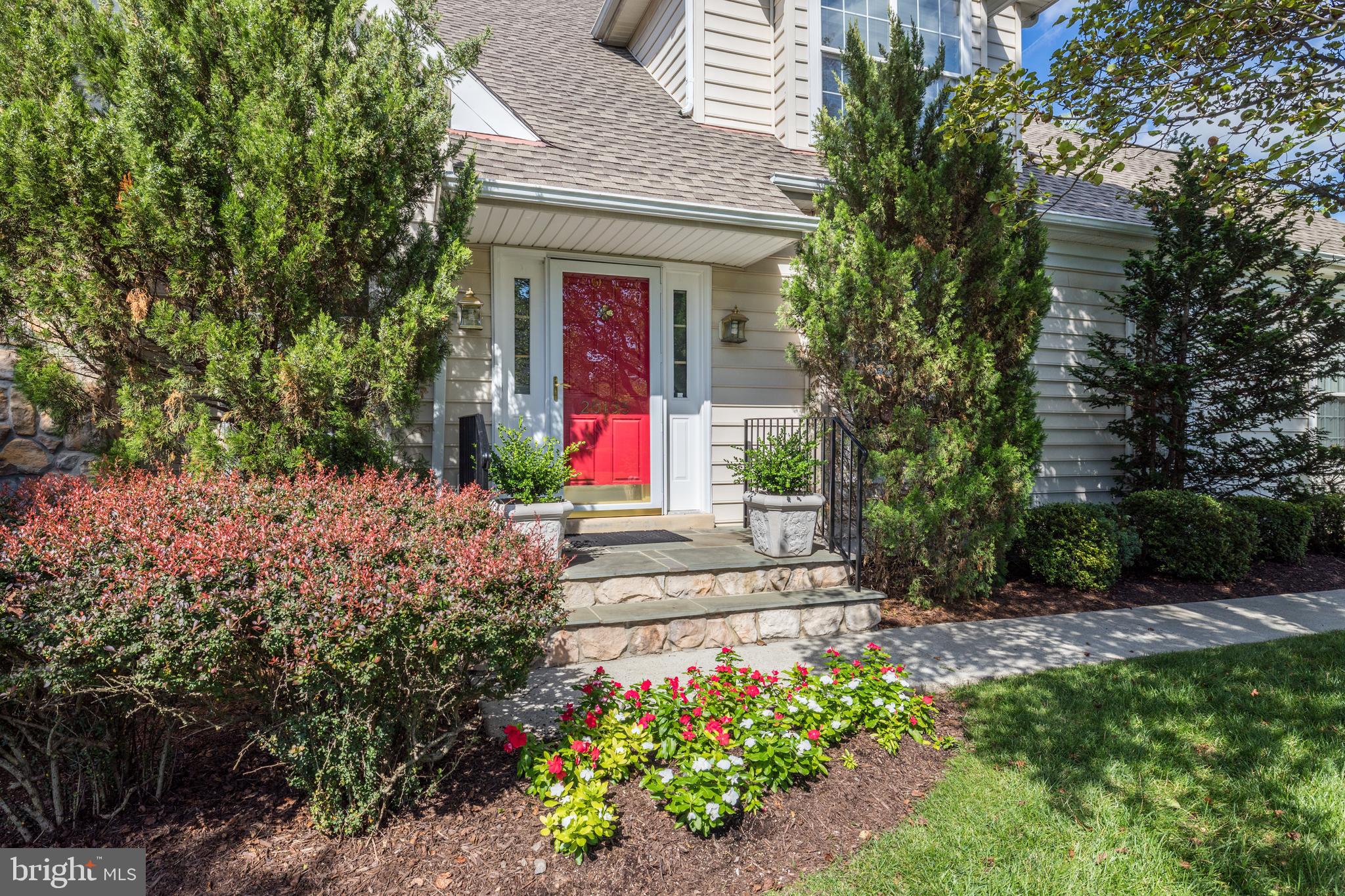 20135 Valhalla Square Ashburn, VA 20147 - Photo 3 of 41 a front view of a house with a yard