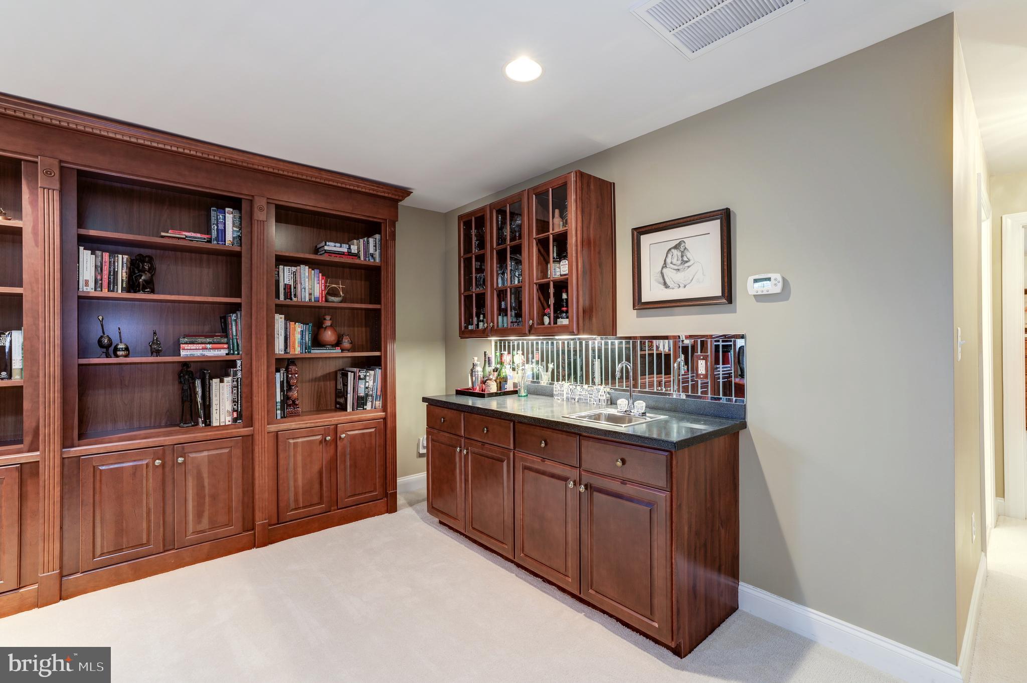 20135 Valhalla Square Ashburn, VA 20147 - Photo 26 of 41 a room with a bookshelf and a bookshelf