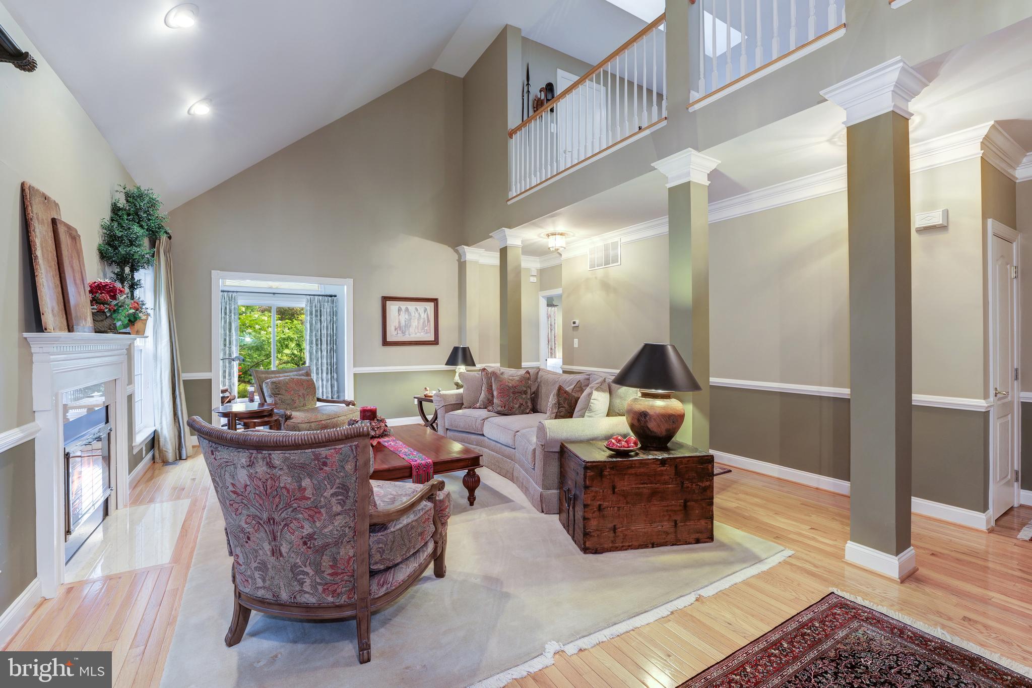 20135 Valhalla Square Ashburn, VA 20147 - Photo 4 of 41 a living room with furniture and a flat screen tv