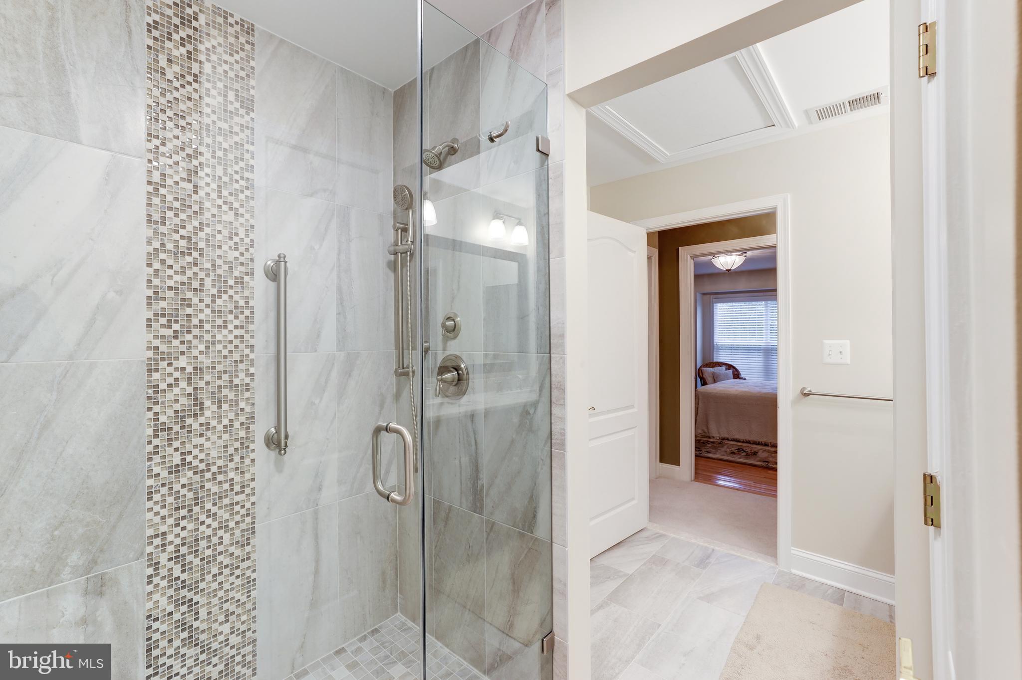 20135 Valhalla Square Ashburn, VA 20147 - Photo 31 of 41 a bathroom with a glass shower door